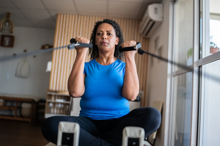 Mid-life woman exercises to alleviate osteoarthritis