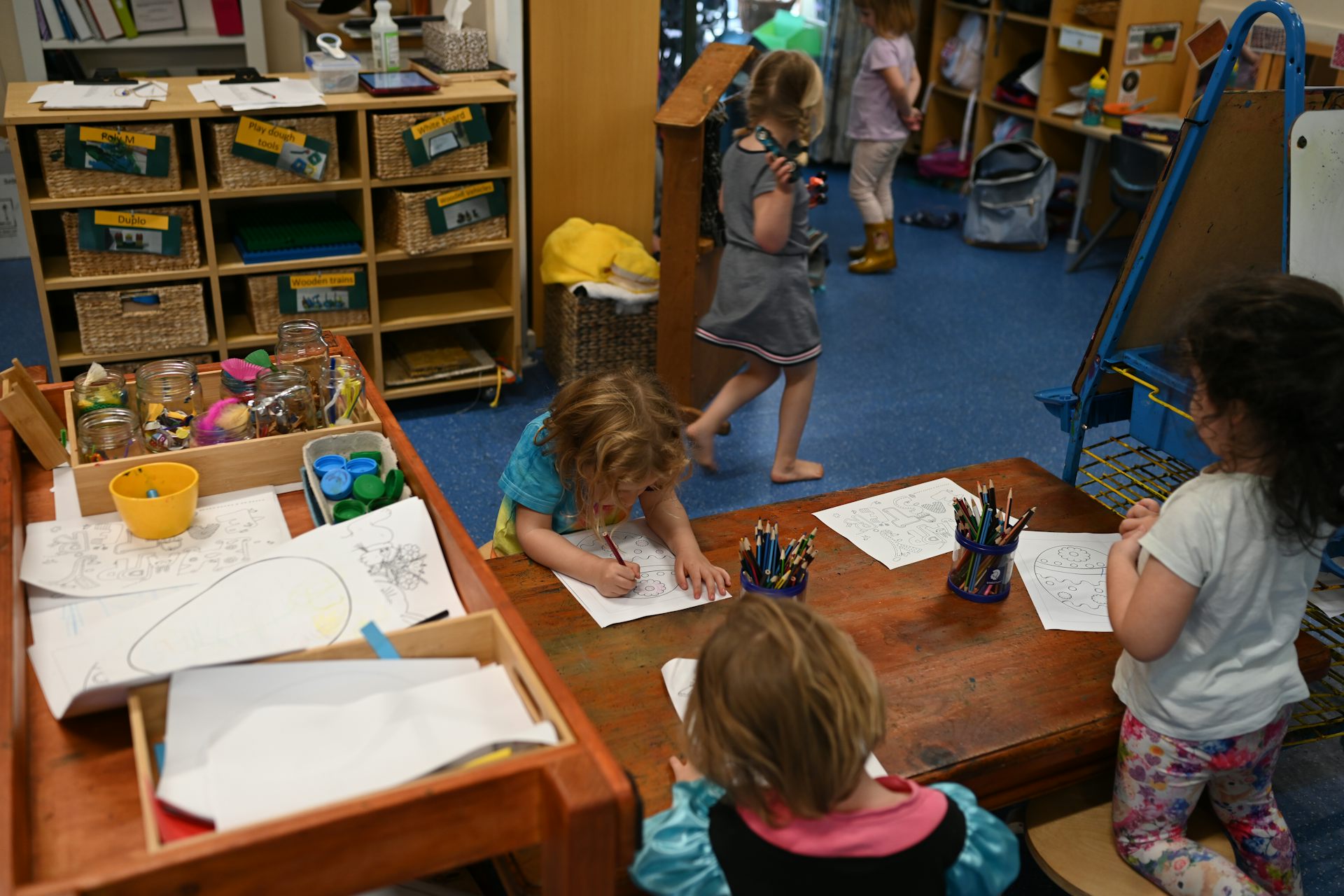 Children play in a daycare classroom