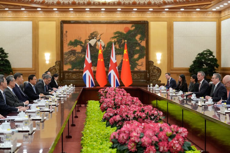 Keir Starmer sits across a table from Xi Jinping in Beijing.