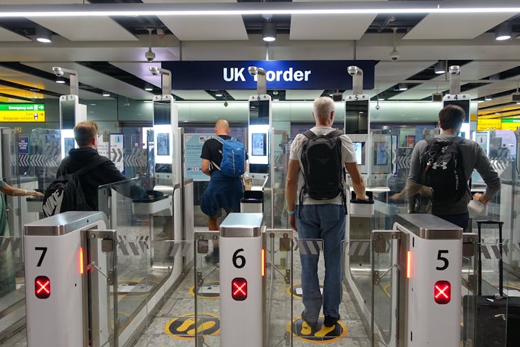 Travellers using e-gates at the UK border