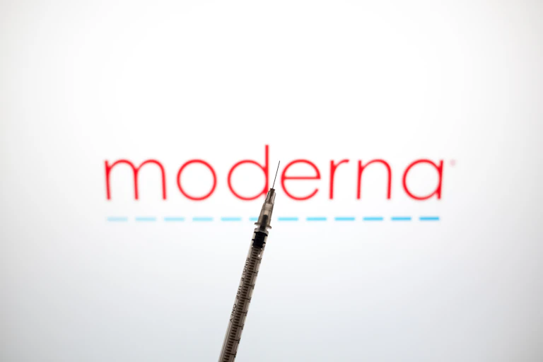 Moderna logo with a syringe