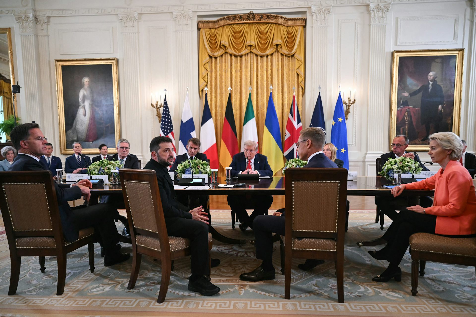 Donald Trump in a room with European leaders and Volodymyr Zelensky.