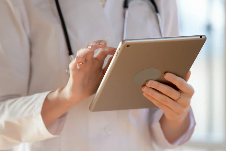 Close up of doctor holding a computer tablet