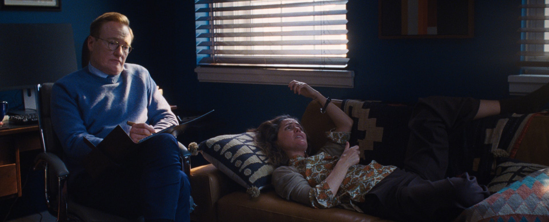 Rose Byrne lies on a couch while her therapist, Conan O'Brien sits in a chair next to her