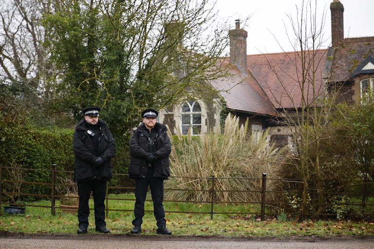 police officers standing outside a building