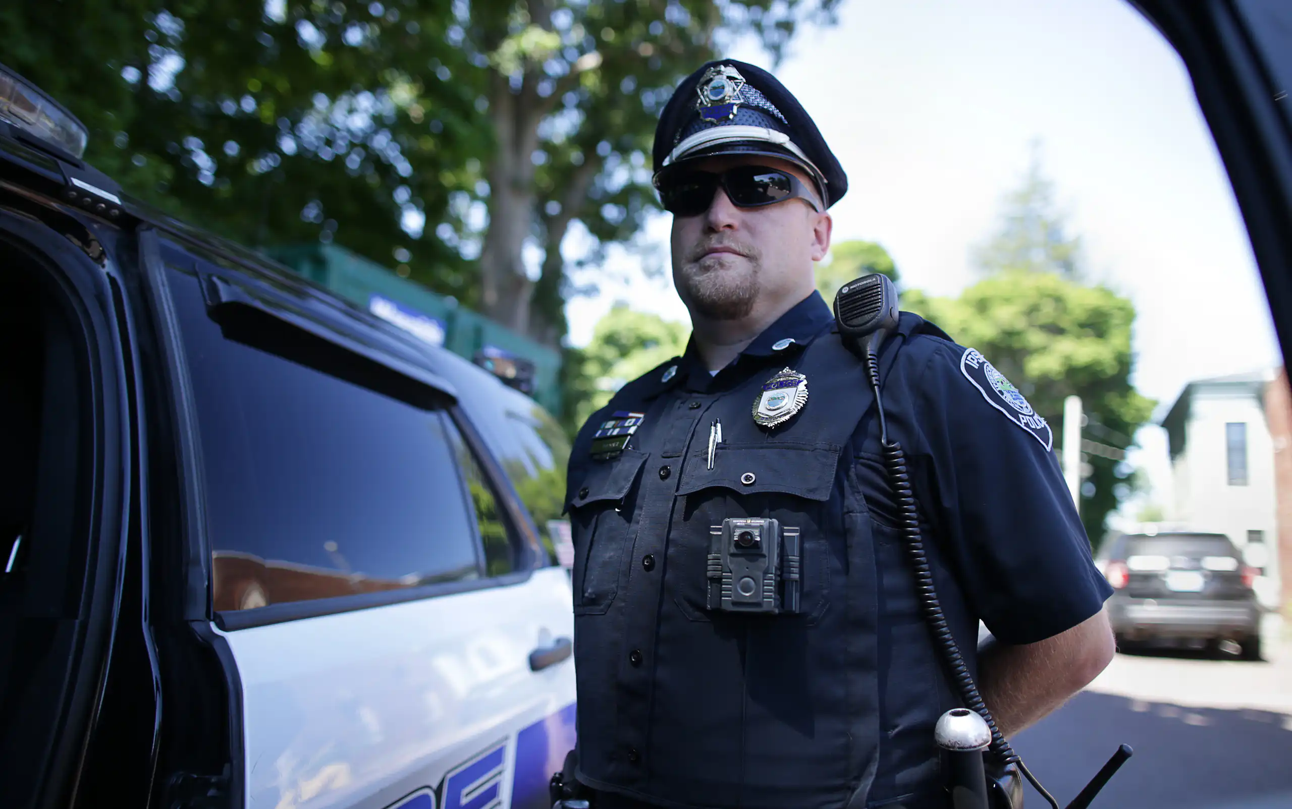 A police officer wears a body camera.
