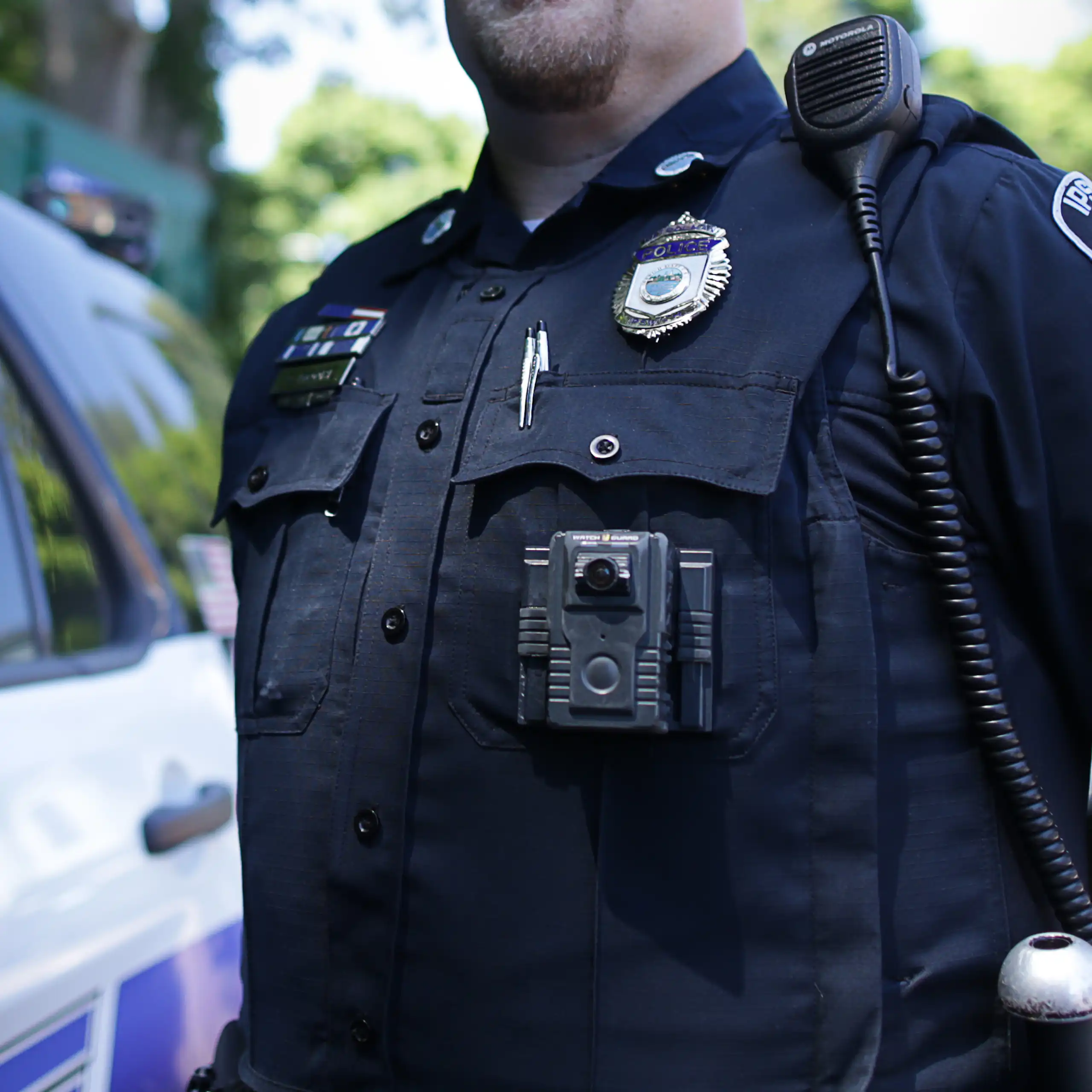 A police officer wears a body camera.