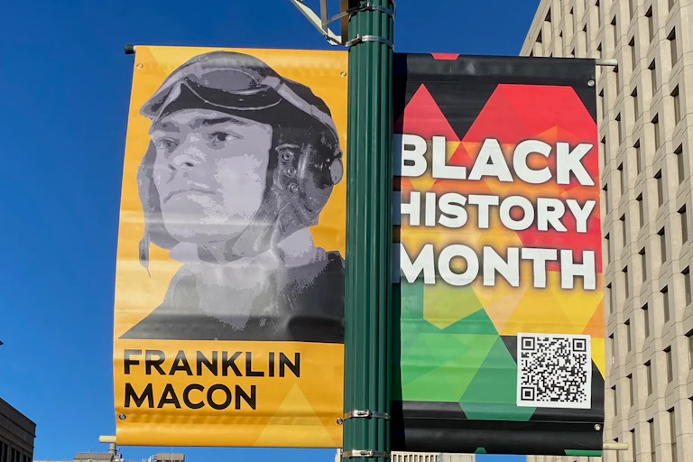 A Black History Month sign depicts Franklin Macon.