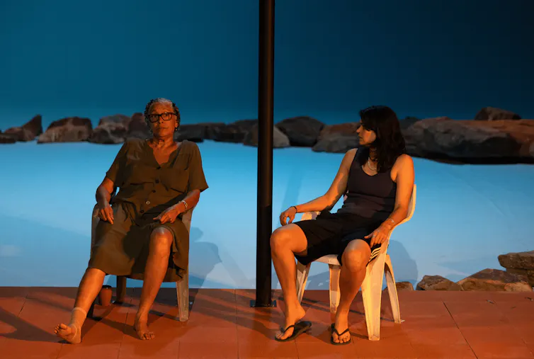 Production image: Aunty and Bub sit outside on a porch