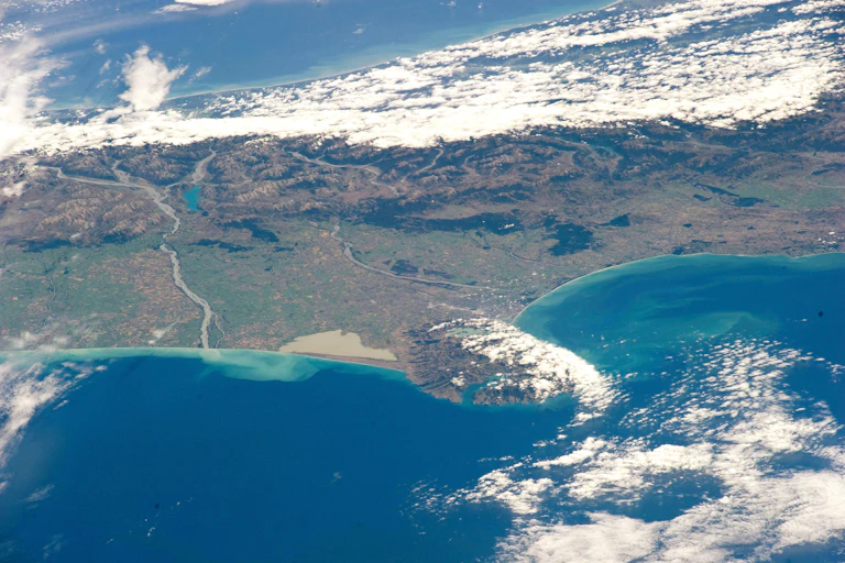 Aerial view of coastline and clouds