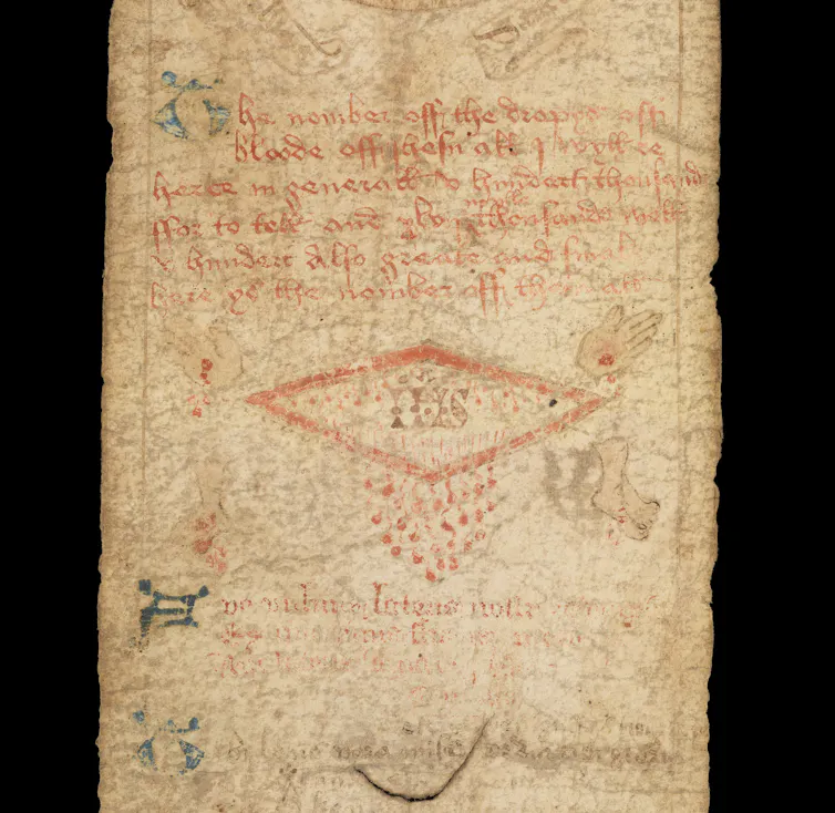 Close up of the medieval birth scroll showing the wound of Christ.