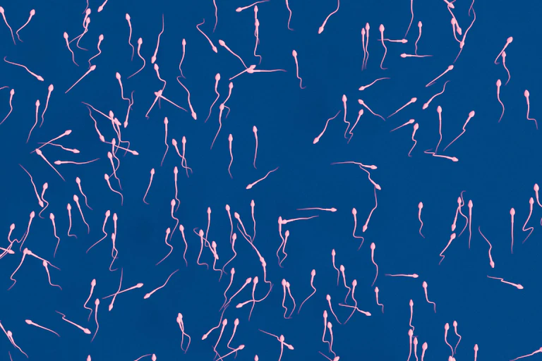 Sperm against a blue background.