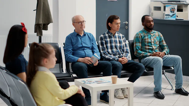 People in a waiting room at a health clinic