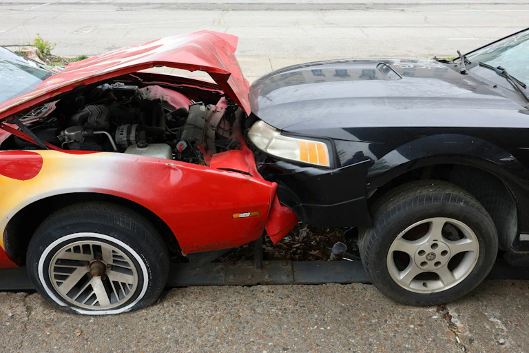 Two cars are left wrecked after crashing into each other.