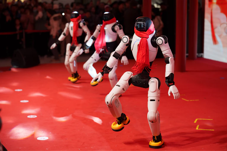 Humanoid robots dance in formation during a Lunar New Year tech temple fair in Beijing, Thursday, Feb. 19, 2026.