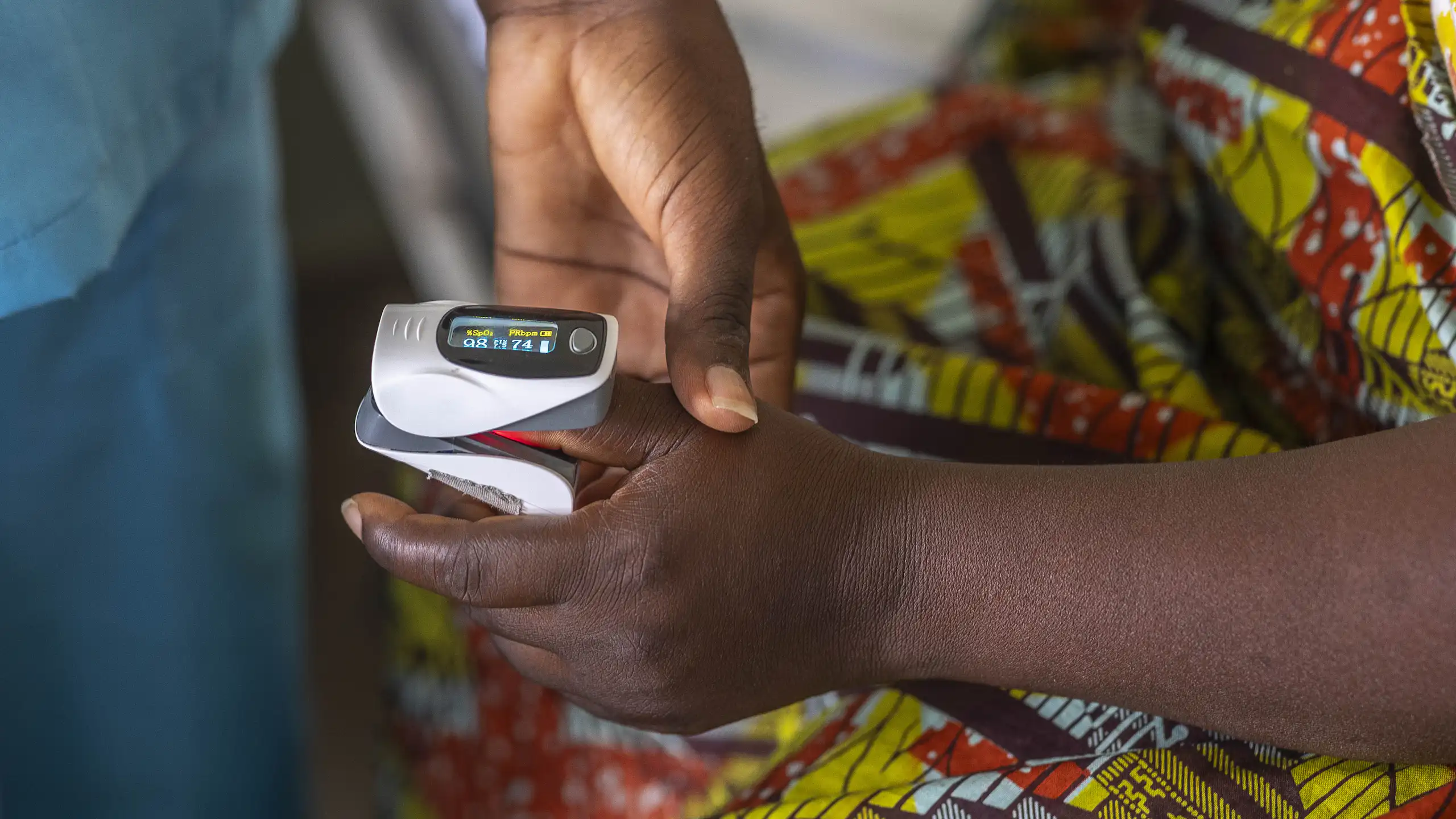 Nurse measuring a patient's oxygen saturation level