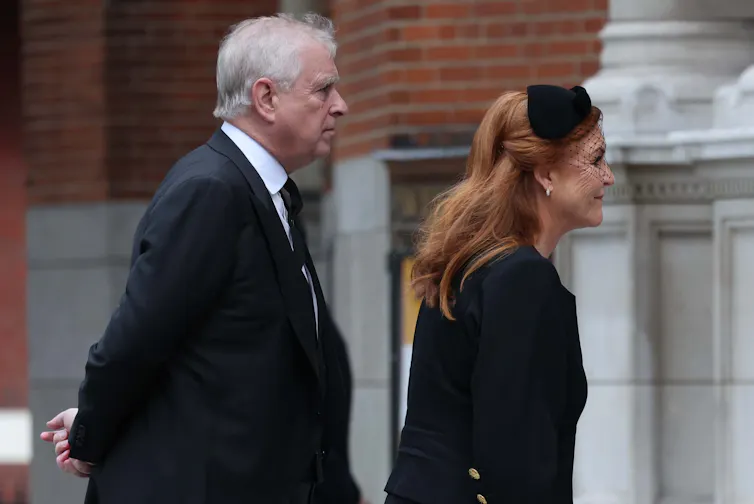 Side view of Mountbatten-Windsor and Ferguson walking into the Duchess of Kent's funeral