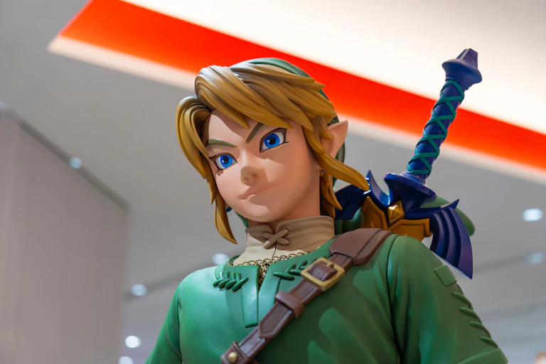 A big statue of the character Link, who looks like a blonde elf.