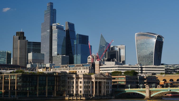 The City of London skyline on the river Thames, London.