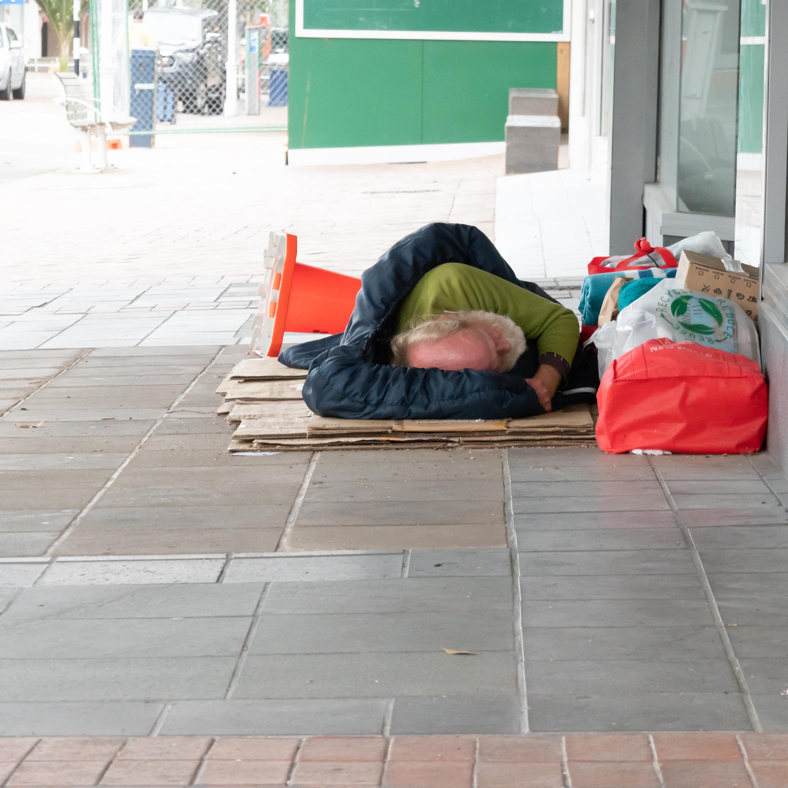 A person sleeping rough in city streets