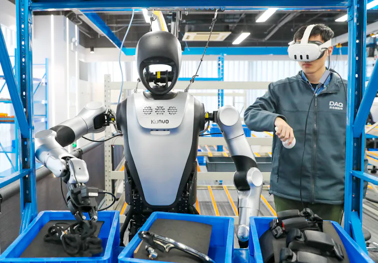 A humanoid robot learns component sorting at the Humanoid Robot Data Collection Training Ground in Qingdao, Shandong, China