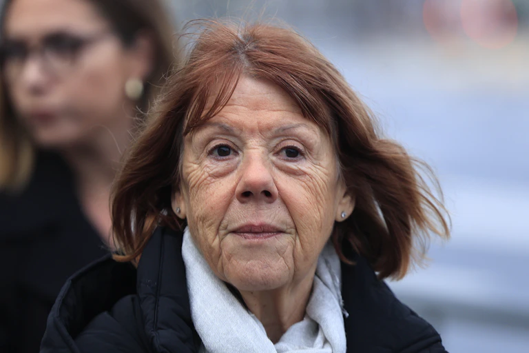 a determined-looking older woman, Gisele Pelicot