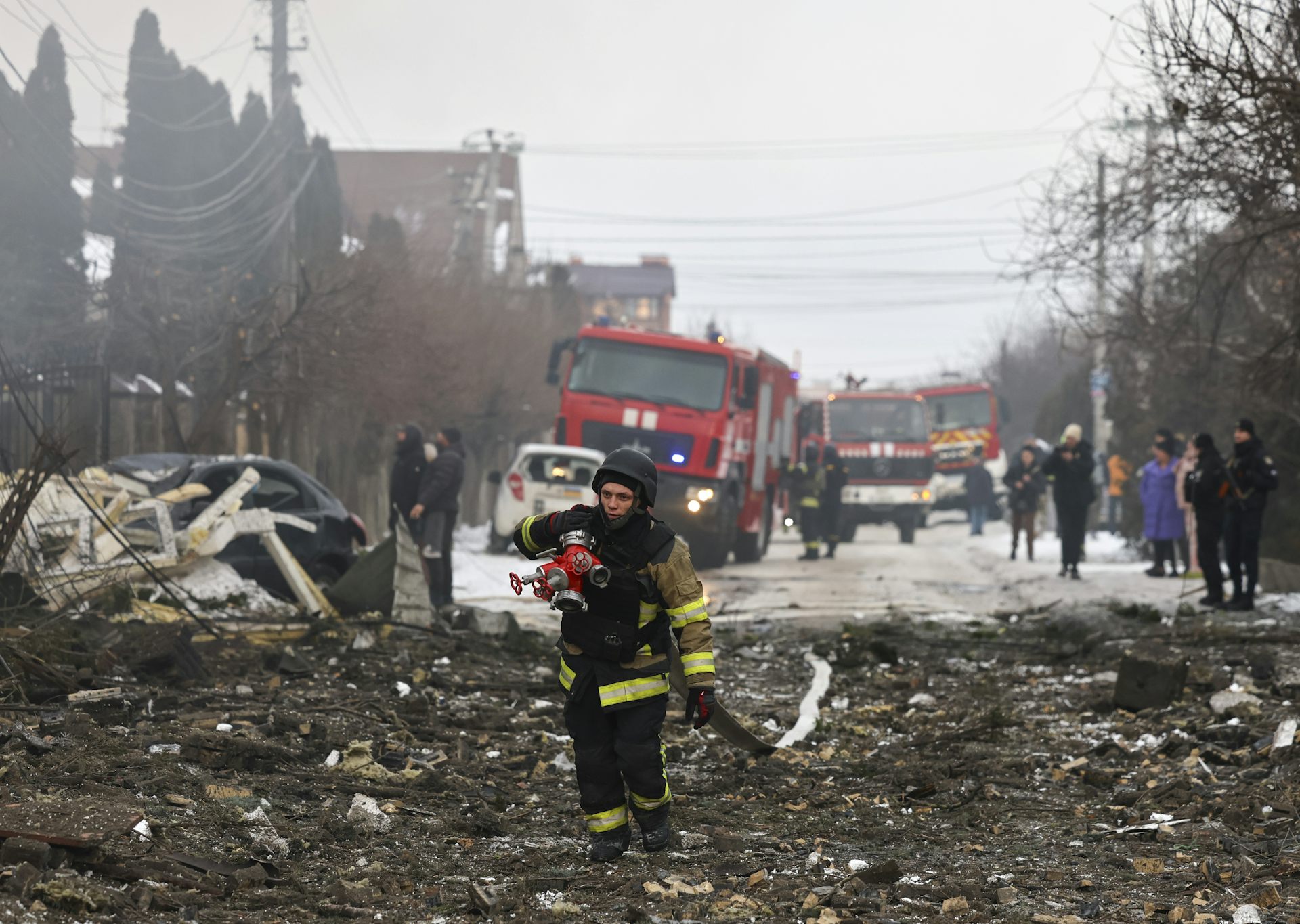 Ukrainian rescuers work at the site of a Russian strike in Kyiv.
