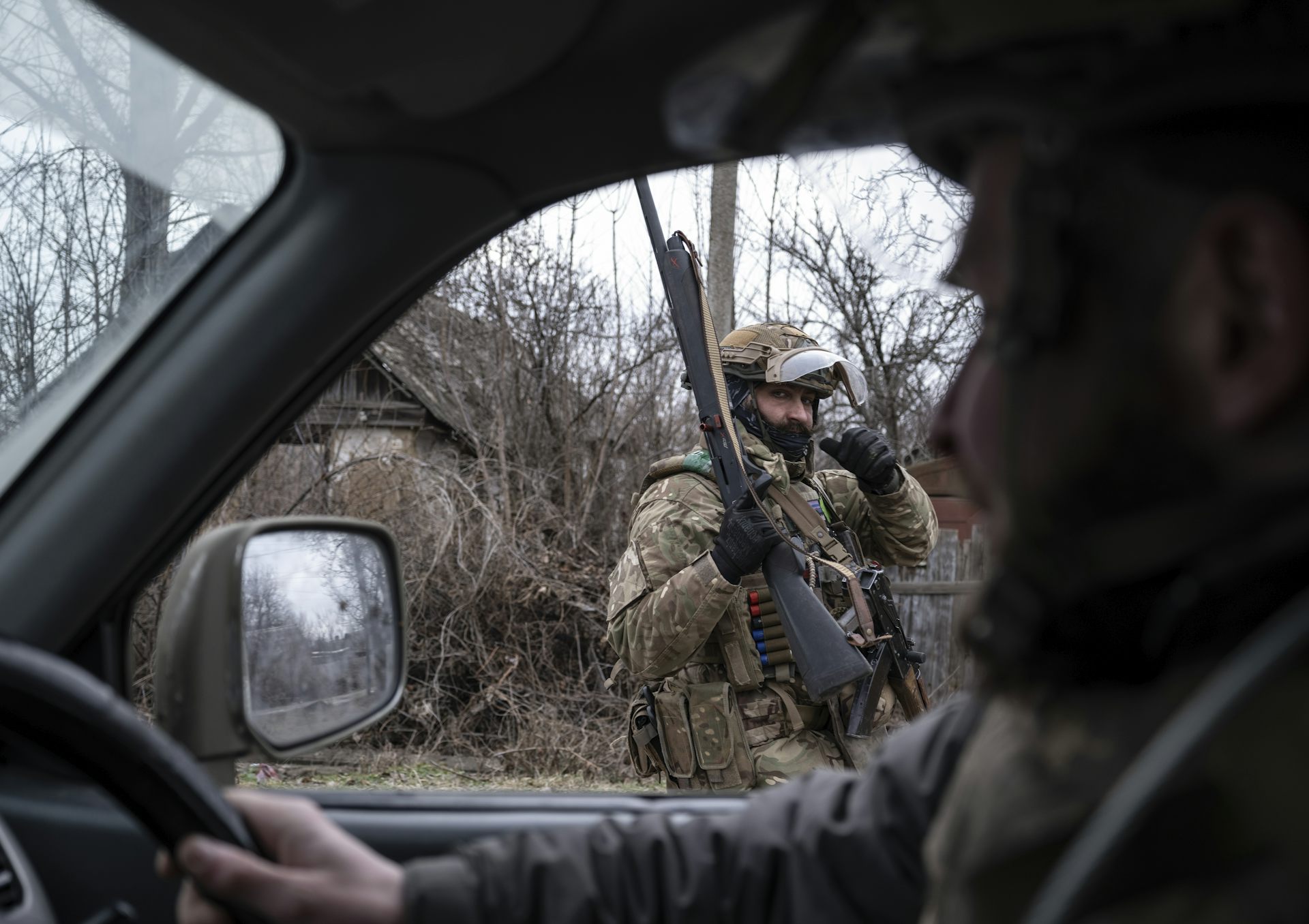 A Ukrainian servicemen stands guard in the Donetsk region.