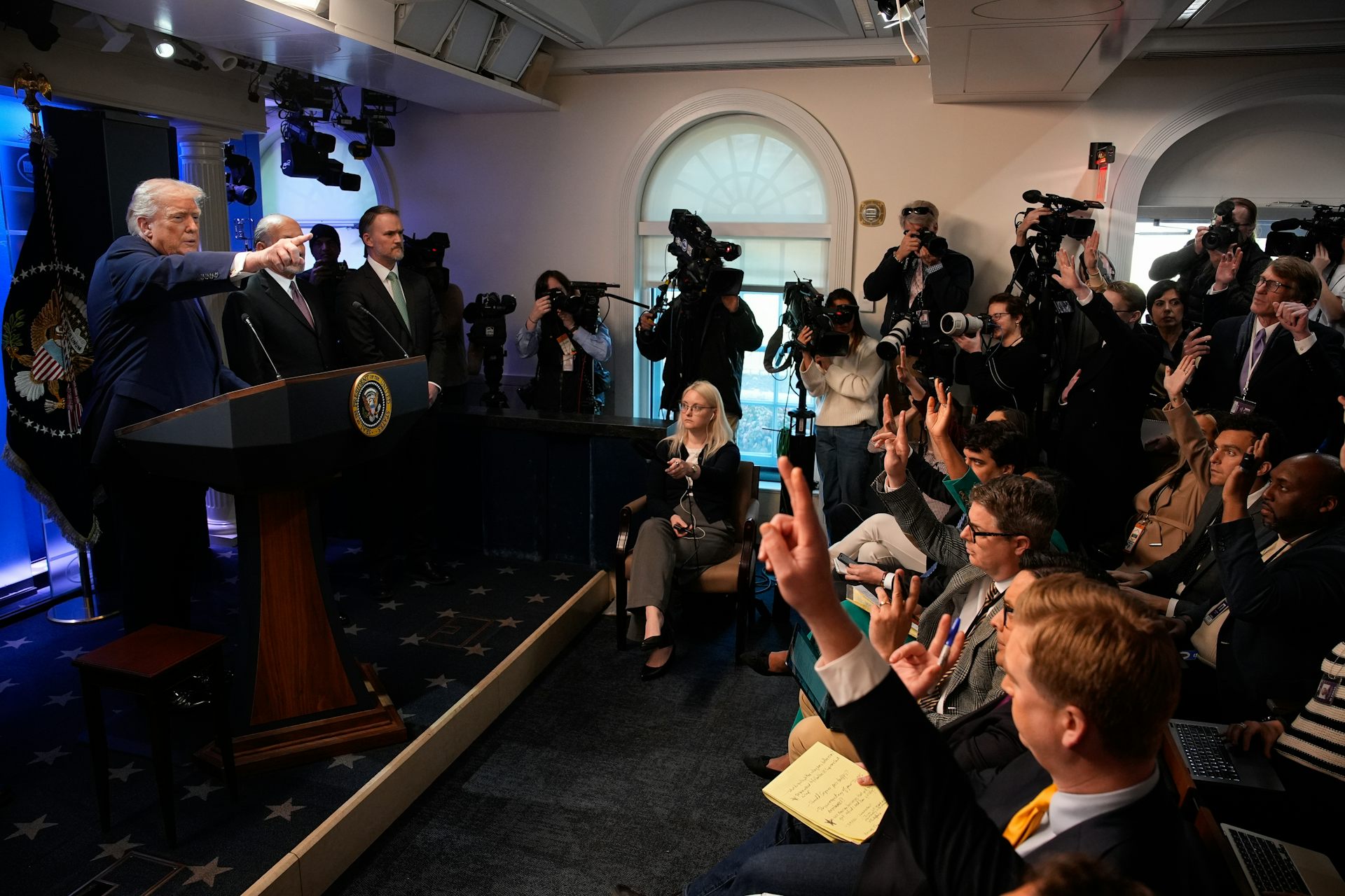 donald trump and reporters during a press conference about the supreme court tariff ruling.