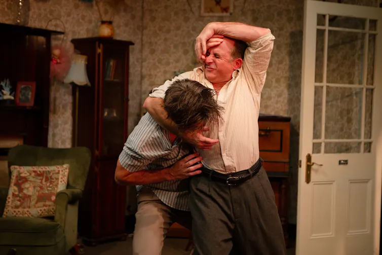 Production image: two men fight.