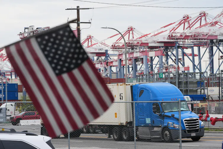 A U.S. flag flies in front of a port