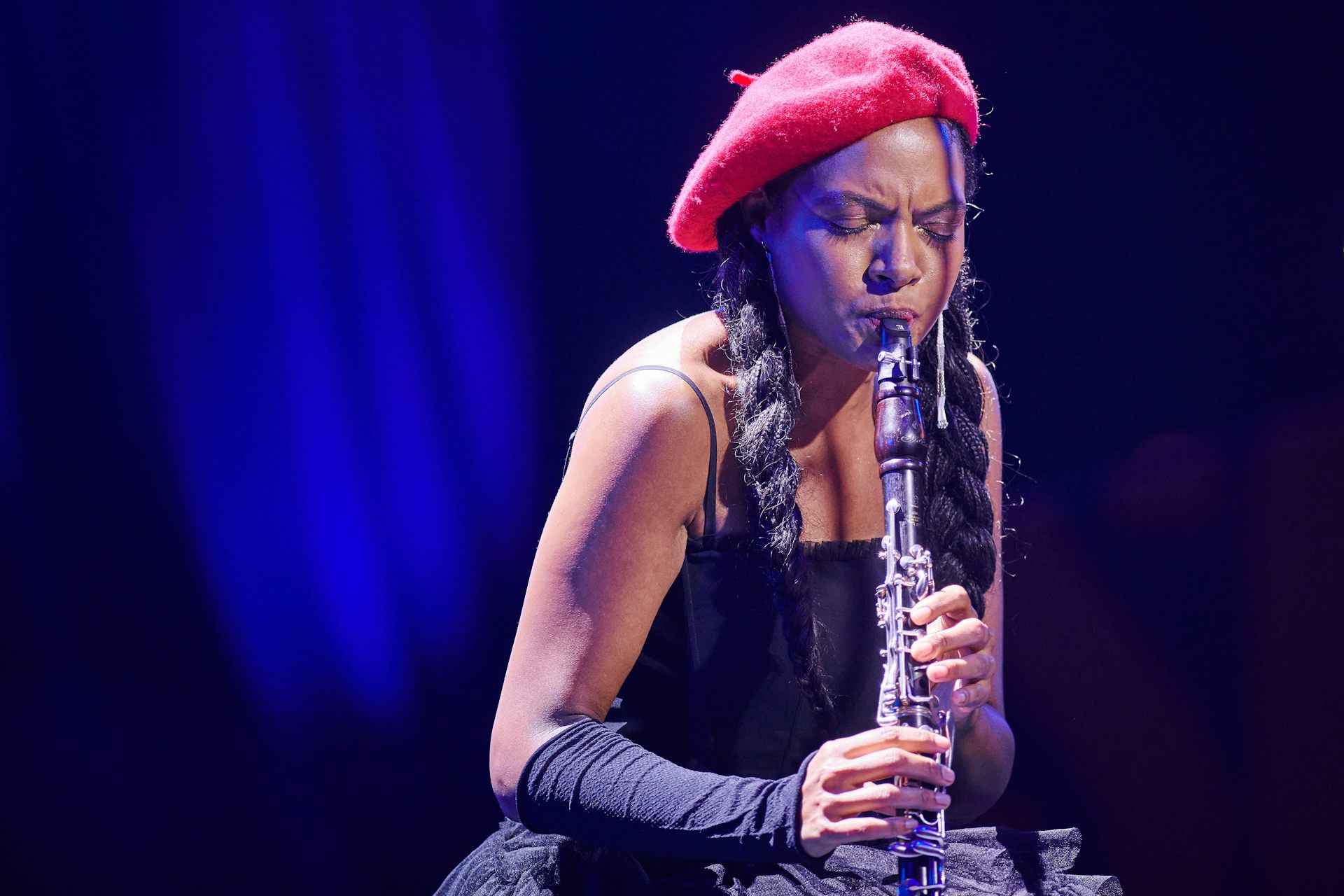 A person with a woodwind instrument.  