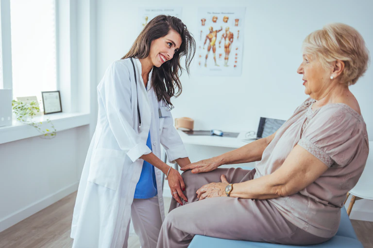 First contact physiotherapist consulting with patient in clinic