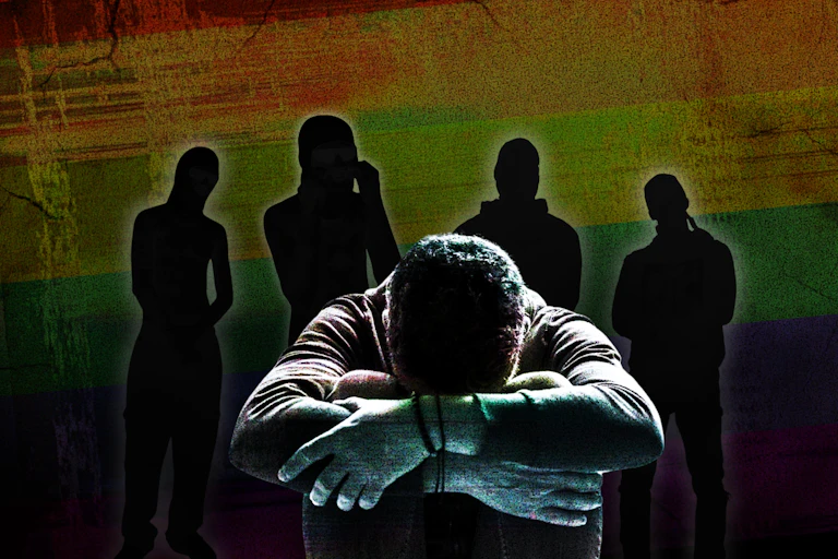 Composite image of a man looking downcast with silhouetted figures behind him