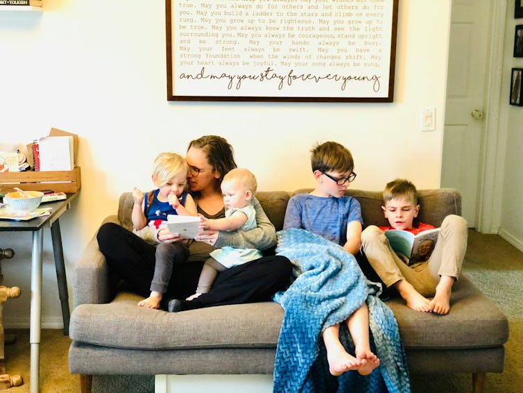 Family reading in living room