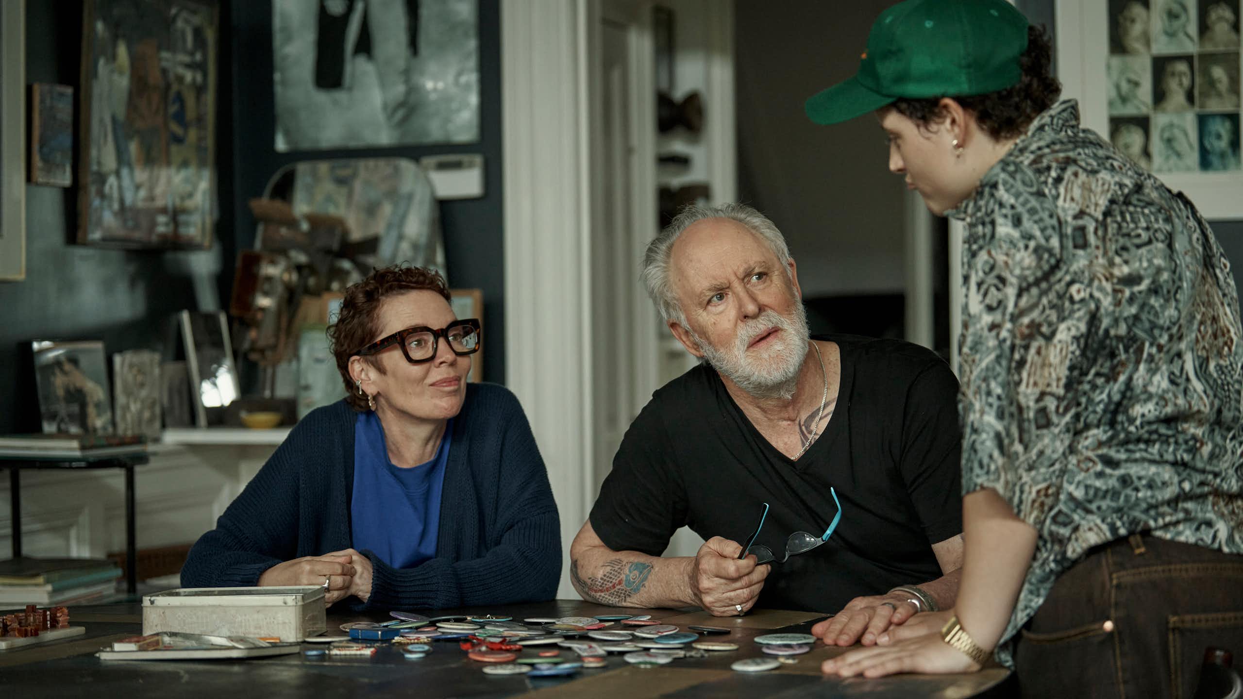 Production image: the family around a table.