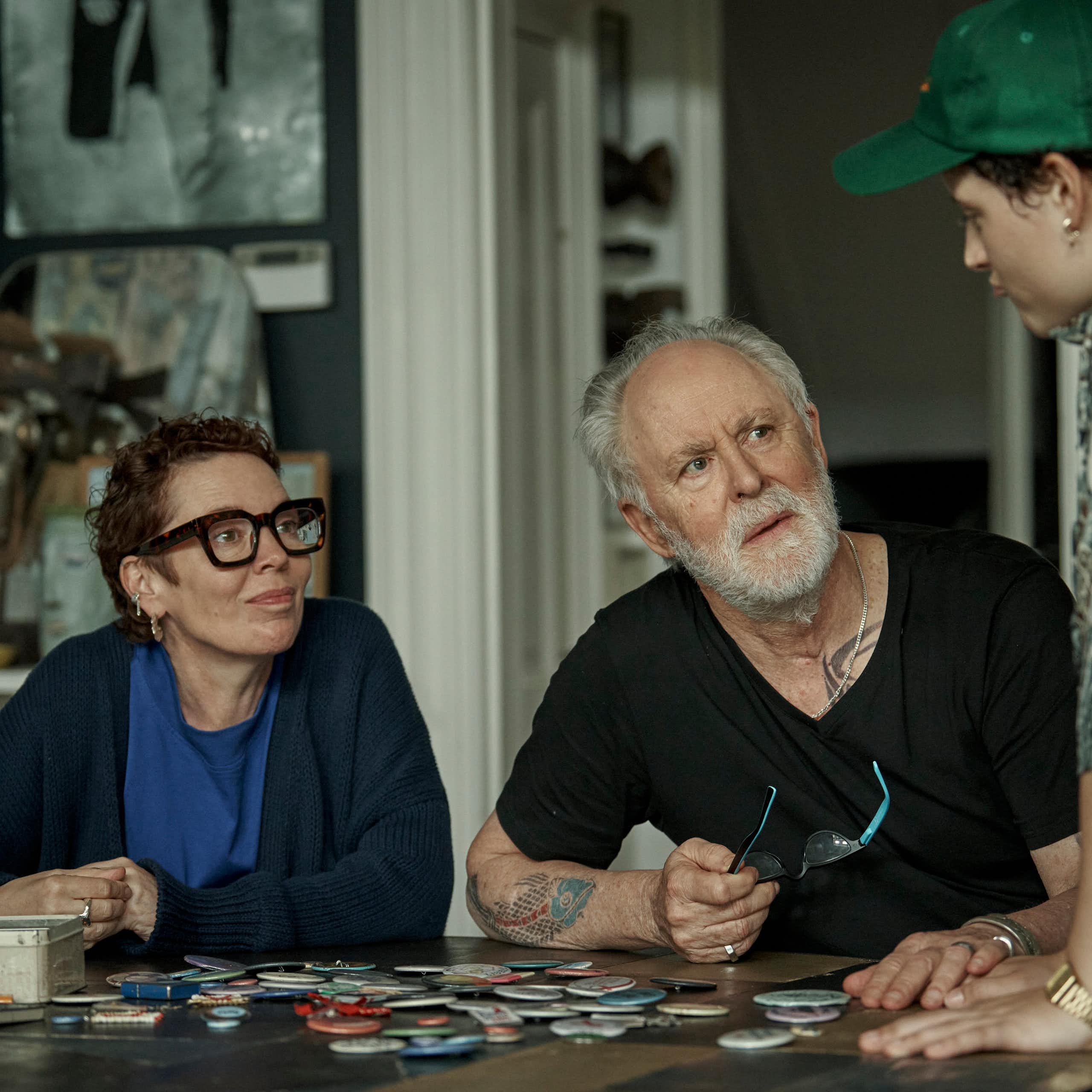 Production image: the family around a table.