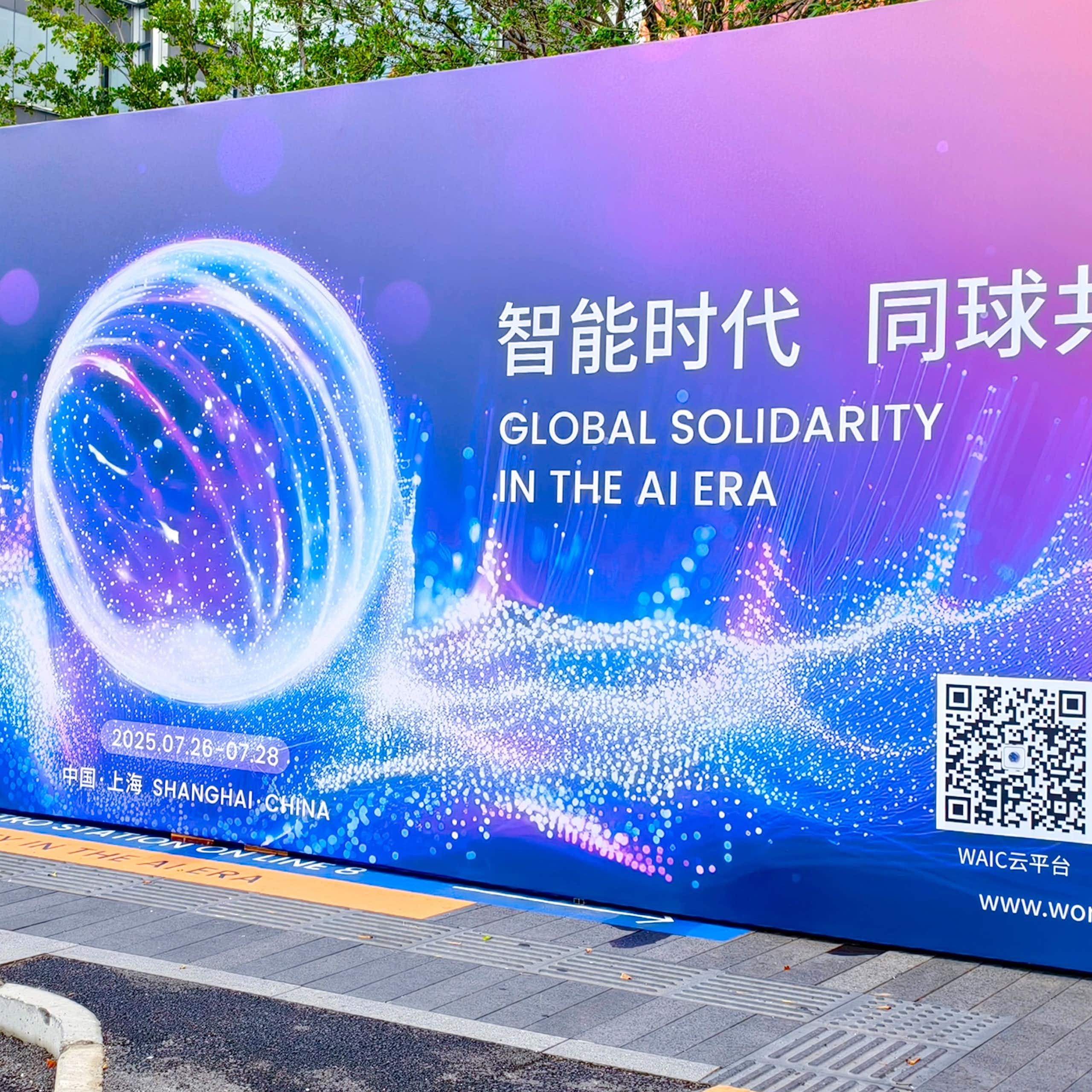 A billboard showing English text reading GLOBAL SOLIDARITY IN THE AI ERA with Chinese text and computer graphics