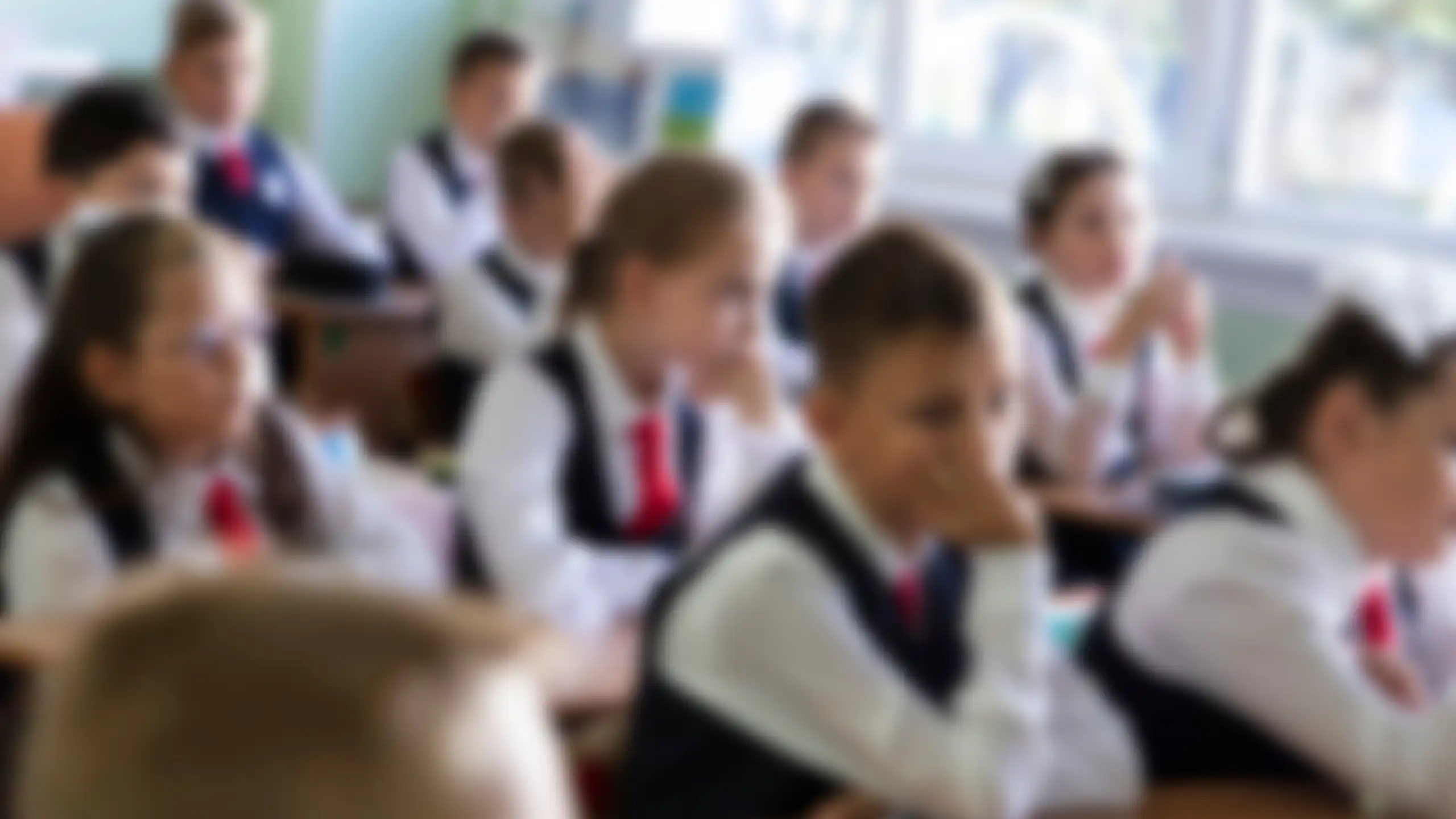 Blurred photo of children in uniform