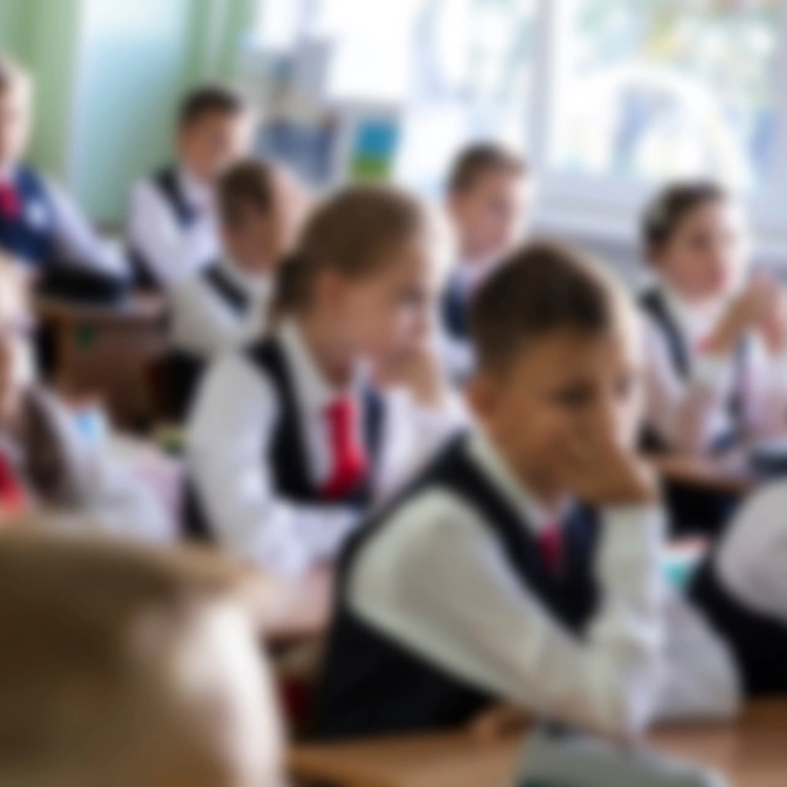 Blurred photo of children in uniform