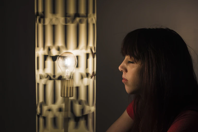 Girl viewing a sixties style Dreamachine