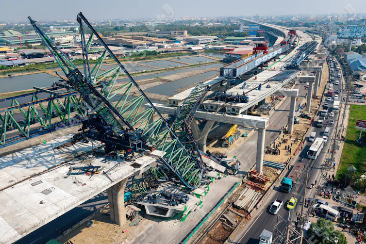 View from above of a collapsed construction crane and the damage to the Rama 2 Road expressway in Thailand.