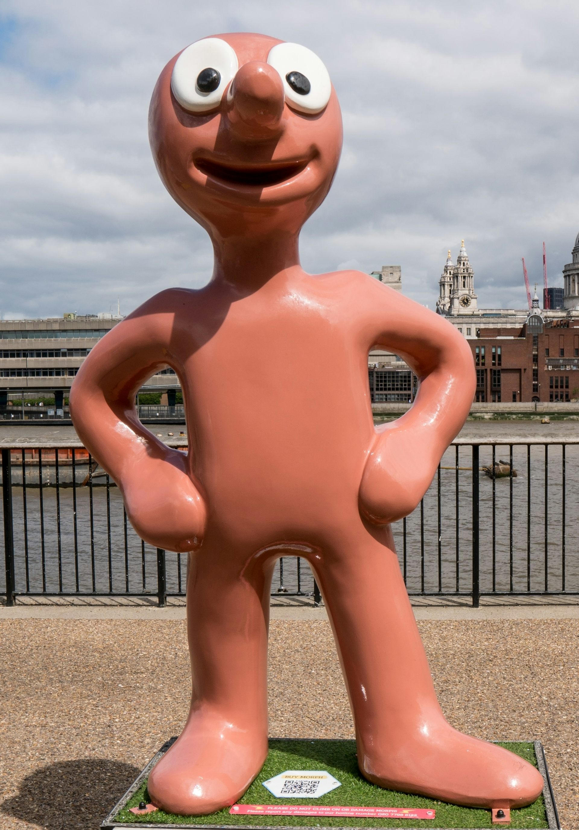 A large model of a Plasticine character with big googly eyes.