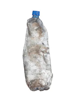 dirty empty plastic bottle on white background