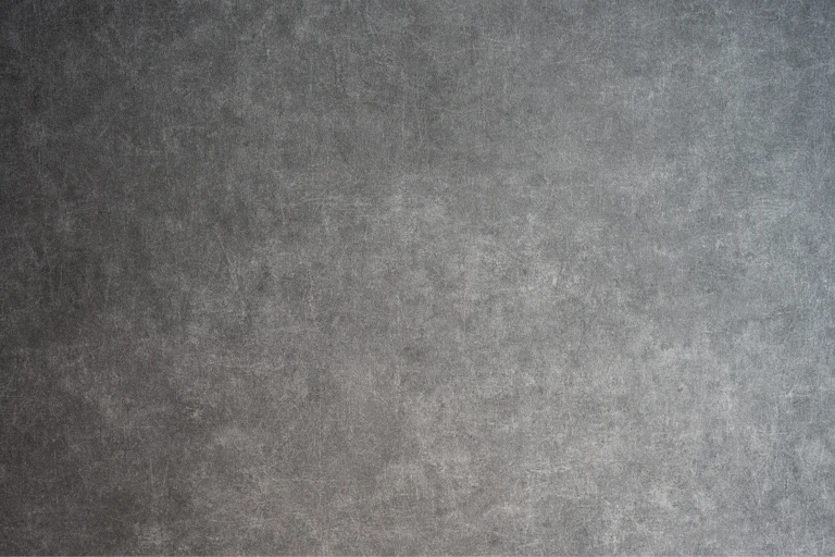 A shaded gray tectured wall.