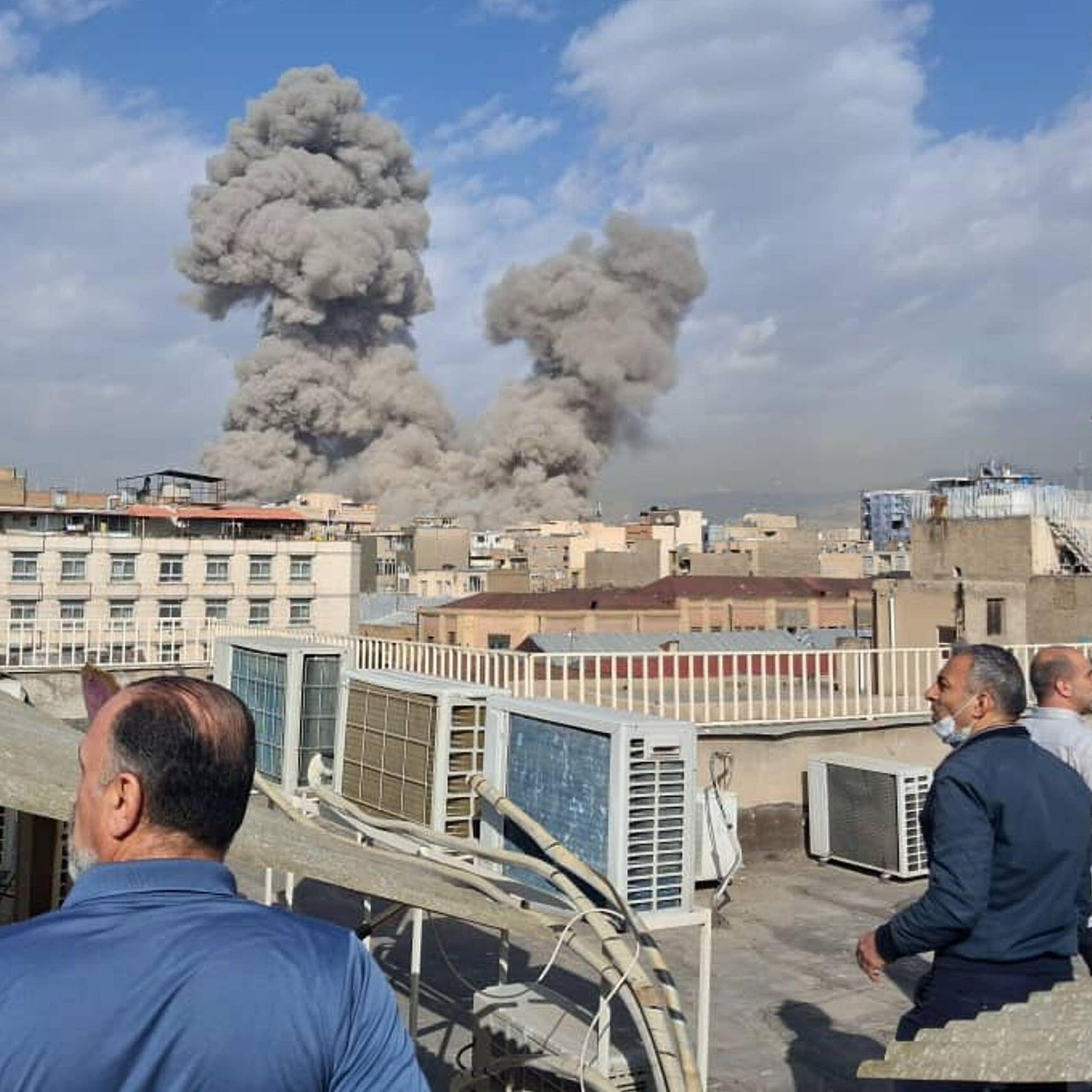 People watch airstrikes in Tehran