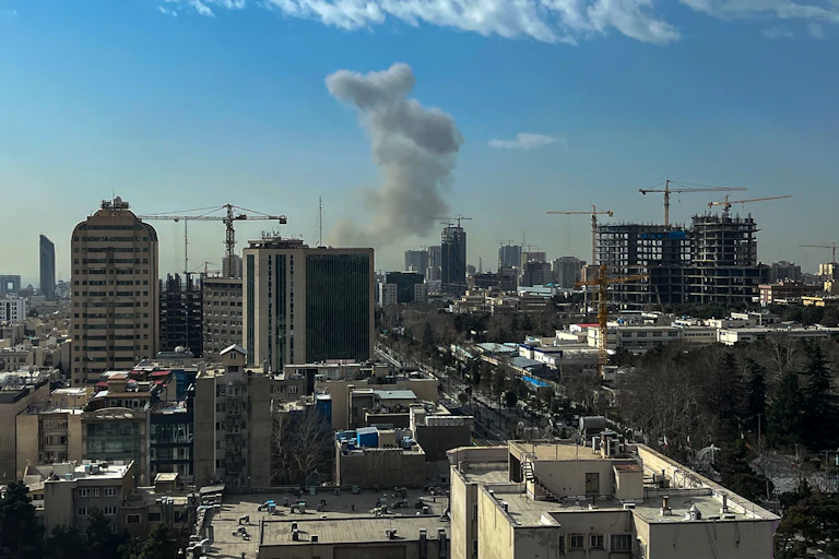 Smoke rised above a city landscape.
