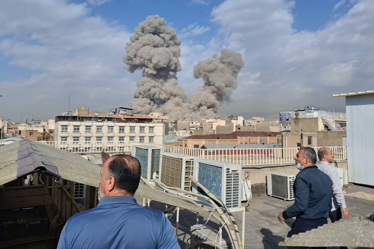 People watch airstrikes in Tehran