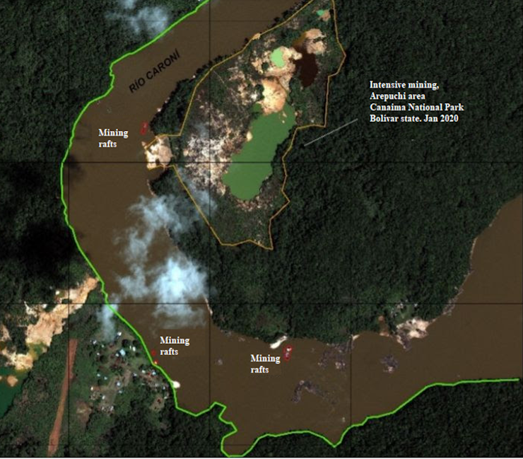 A satellite image shows mined areas in the bend of a river