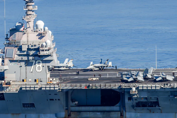 A large military ship is seen at sea.